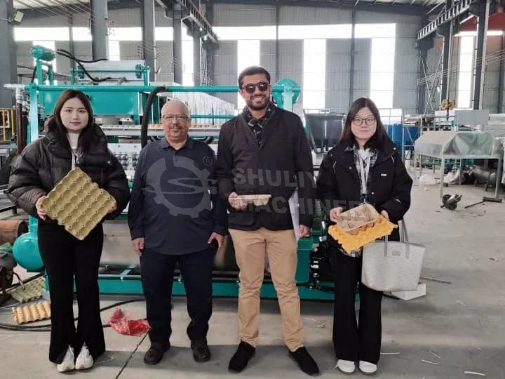 Customers visit egg carton maker factory